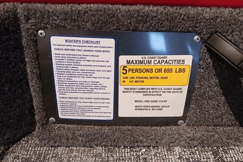 Slide: The Image of 2026 Tracker Pro Guide V-16 WT capacity plate, 5 persons or 655 lbs, safety checklist included. - 27