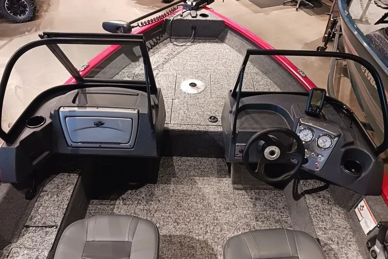 Slide: The Image of 2026 Tracker Pro Guide V-16 WT boat interior with dual consoles and modern dashboard. - 20
