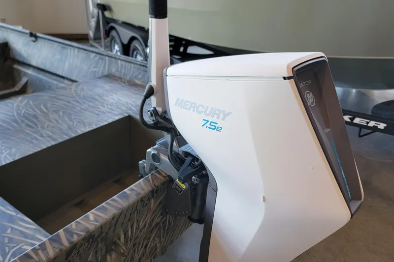 Slide: The Image of 2026 Tracker Grizzly 15 Jon boat with Mercury 7.5e motor, showcasing modern design. - 2