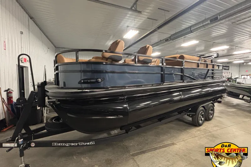 The Image of 2026 Ranger 223FC pontoon boat on trailer in indoor showroom. - 0