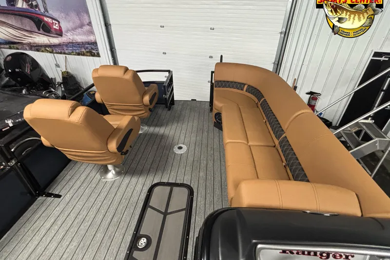 Slide: The Image of Interior of 2026 Ranger 223FC boat with tan seating and modern design. - 10