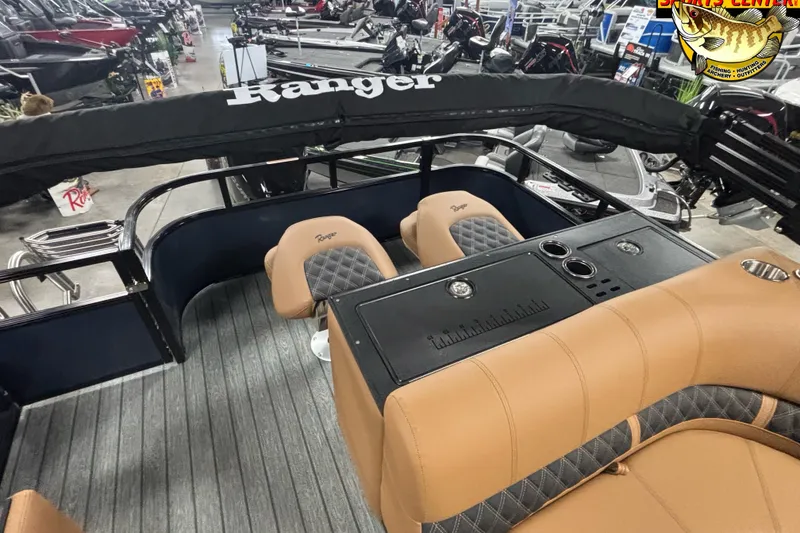 Slide: The Image of Interior of 2026 Ranger 223FC boat with tan seats and black console. - 11