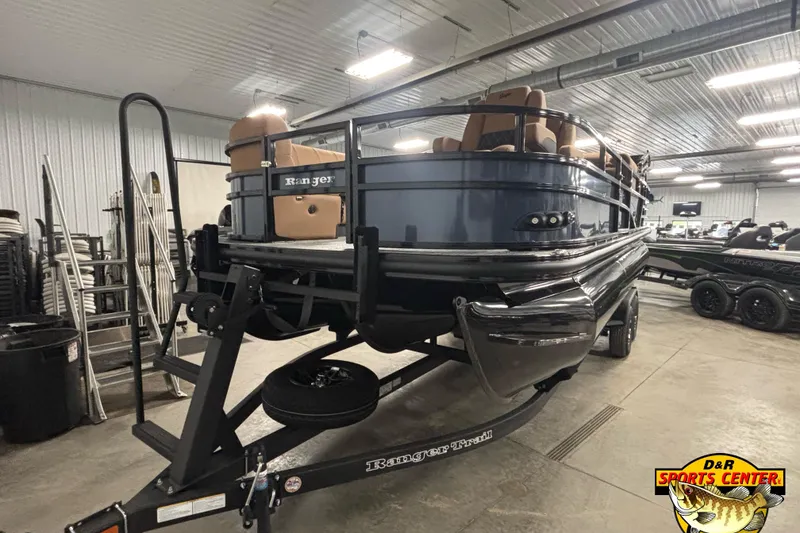 Slide: The Image of 2026 Ranger 223FC pontoon boat in showroom, featuring sleek design and comfortable seating. - 2