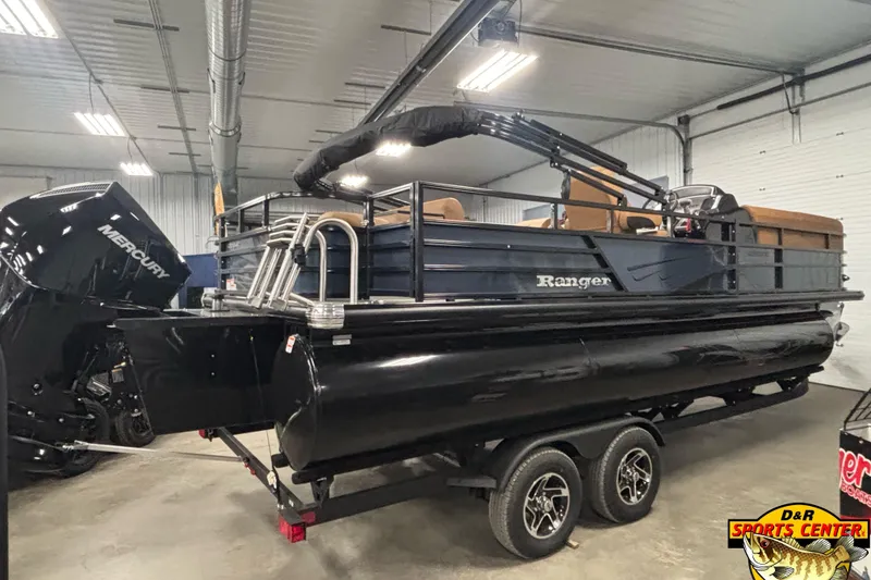 Slide: The Image of 2026 Ranger 223FC pontoon boat with Mercury engine in showroom, displayed on trailer. - 3
