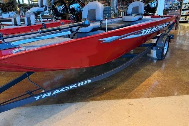 Slide: The Image of 2026 Tracker Panfish 17 boat in showroom, featuring sleek red design and comfortable seating. - 3