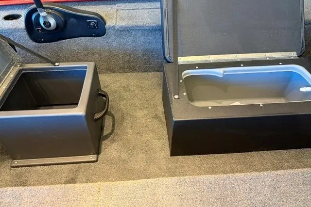 Slide: The Image of Interior of 2026 Tracker Panfish 17 boat showing storage compartments and control panel. - 46
