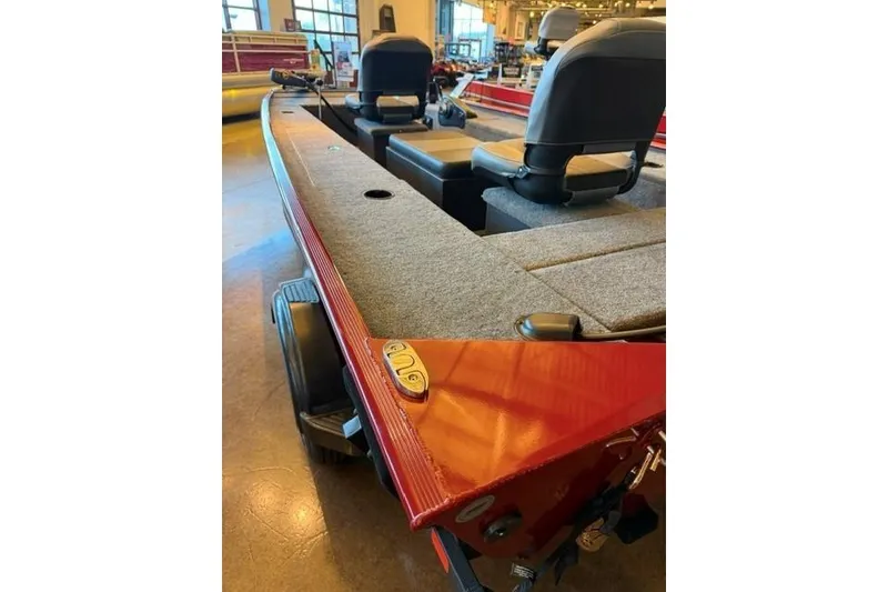 Slide: The Image of 2026 Tracker Panfish 17 boat interior with seating and carpeted deck. - 4