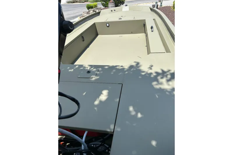 Slide: The Image of 2026 Tracker Grizzly 1654 T Sportsman boat interior, showcasing spacious deck layout. - 5