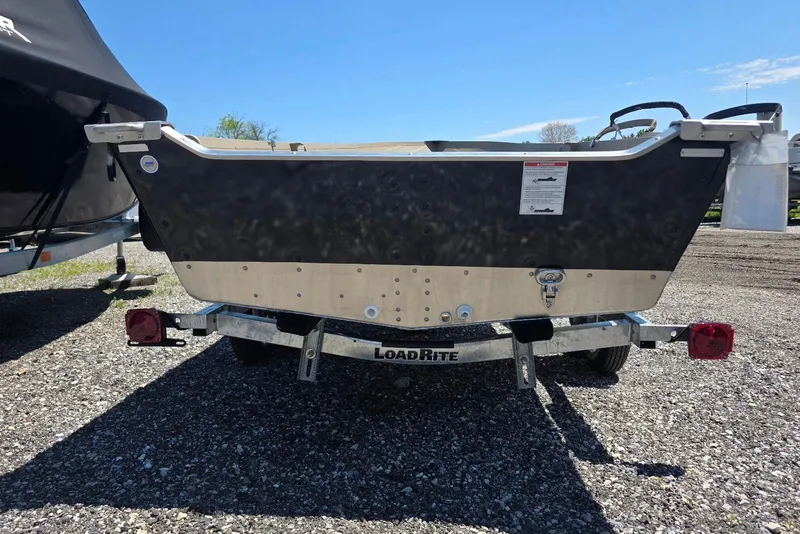 Slide: The Image of 2026 Smoker Craft Voyager 16 boat on Load Rite trailer, parked outdoors. - 3