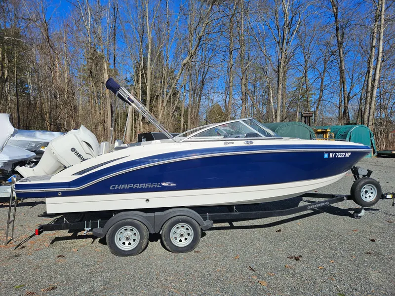 The Image of 2020 Chaparral 230 Suncoast boat on trailer outdoors. - 0