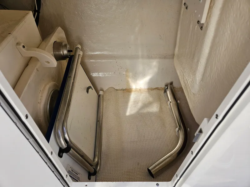 Slide: The Image of Interior of 2020 Chaparral 230 Suncoast boat, showing storage area. - 11