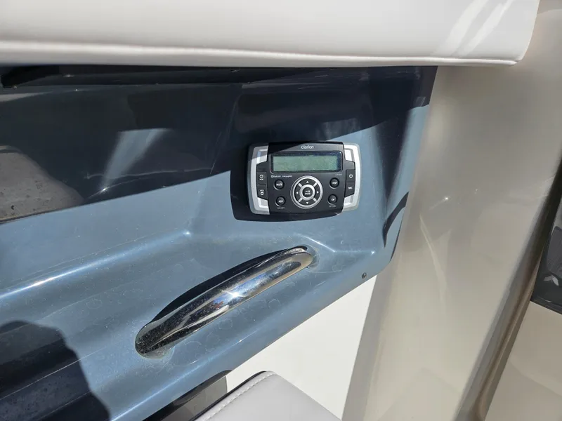 Slide: The Image of 2020 Chaparral 230 Suncoast boat control with audio system. - 13