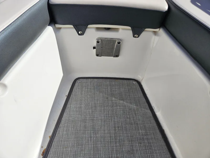 Slide: The Image of Interior of 2020 Chaparral 230 Suncoast with gray carpet flooring. - 15