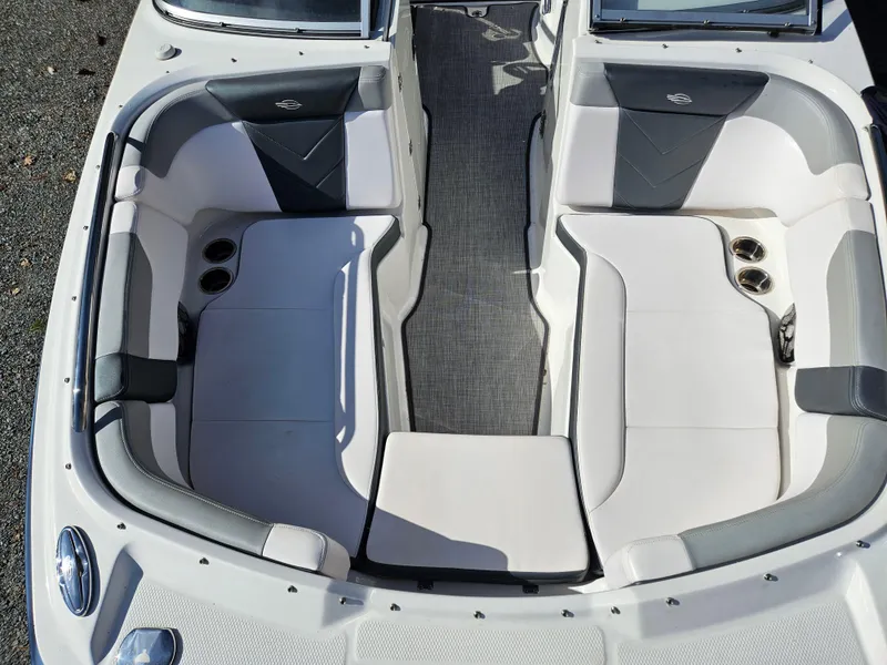 Slide: The Image of Interior of 2020 Chaparral 230 Suncoast with gray and white seating. - 18