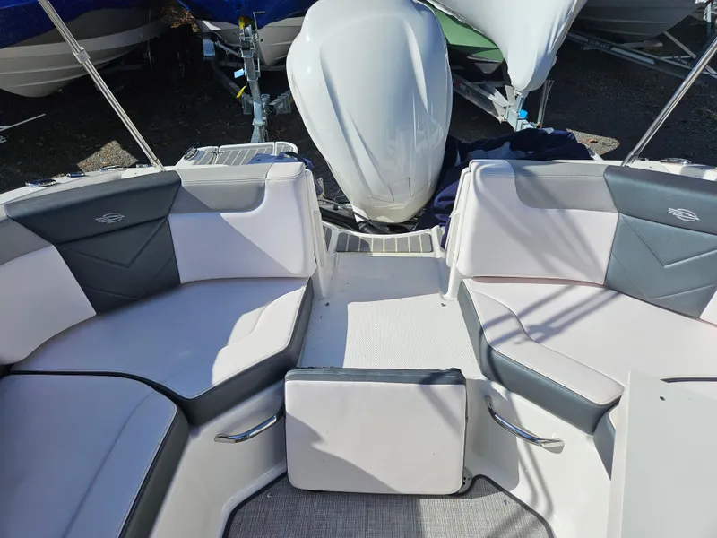 Slide: The Image of Interior of a 2020 Chaparral 230 Suncoast boat with gray seating. - 22