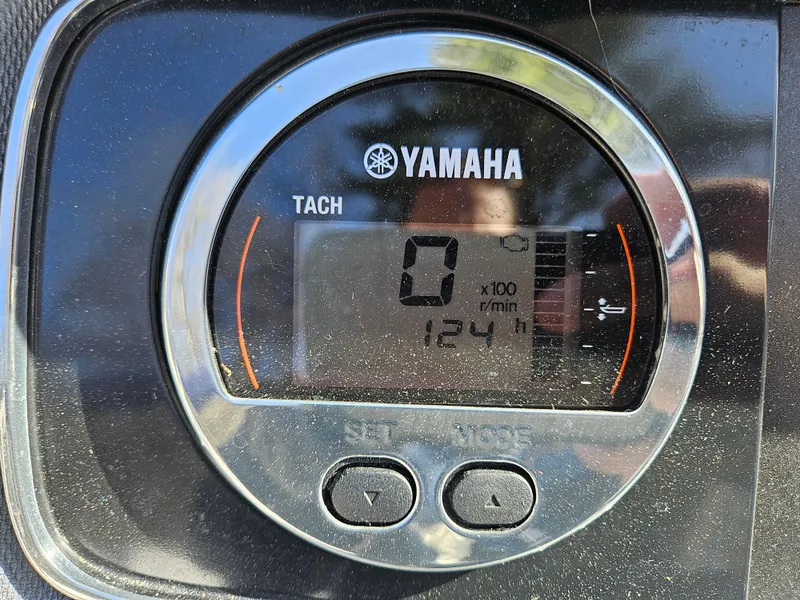 Slide: The Image of Yamaha tachometer on 2020 Chaparral 230 Suncoast, displaying 124 hours. - 24