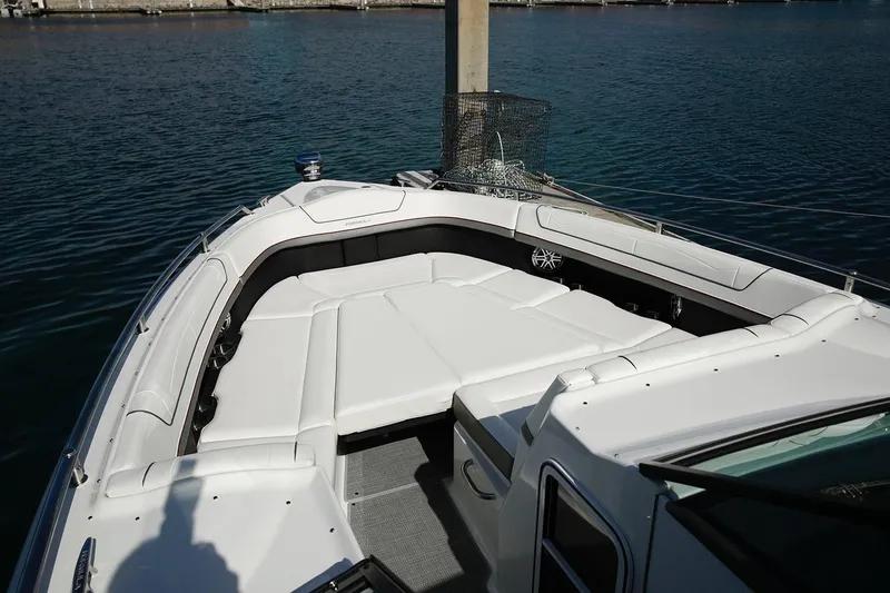 Slide: The Image of Manufacturer Provided Image: 2021 Formula 350 Crossover Bowrider I/O, spacious bow seating area, docked on calm water. - 12