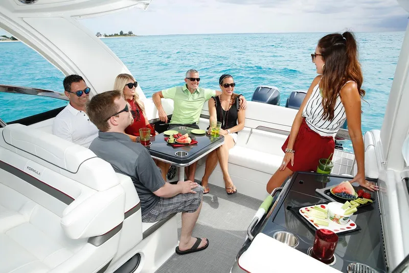 Slide: The Image of Manufacturer Provided Image: People enjoying on a 2021 Formula 350 Crossover Bowrider I/O boat. - 9