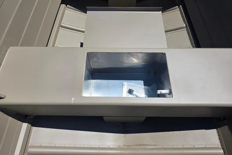 Slide: The Image of 2026 Smoker Craft Voyager 16 boat compartment with open storage area. - 6