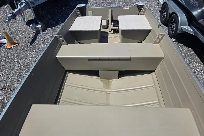 Slide: The Image of 2026 Smoker Craft Voyager 16 boat interior with seating and storage compartments. - 7
