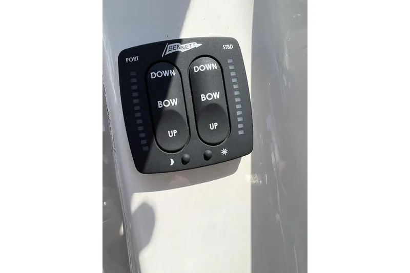 Slide: The Image of Bennett trim tab control panel on 2014 Stingray 250 LR boat. - 6