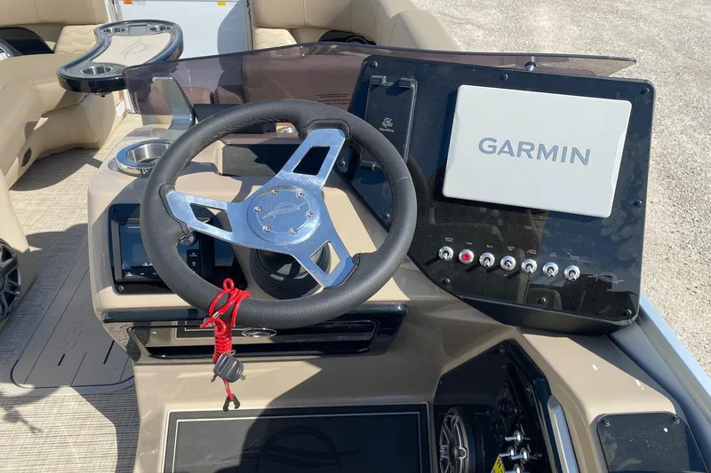 Slide: The Image of Steering console of 2026 SunCatcher Elite 324 SS with Garmin navigation system. - 10
