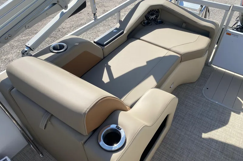 Slide: The Image of Luxurious seating on 2026 SunCatcher Elite 324 SS boat with cup holders and speaker. - 11