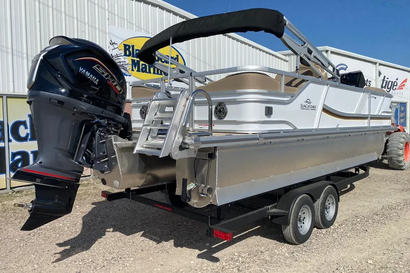 Slide: The Image of 2026 SunCatcher Elite 324 SS pontoon boat on trailer, featuring Yamaha outboard motor. - 6