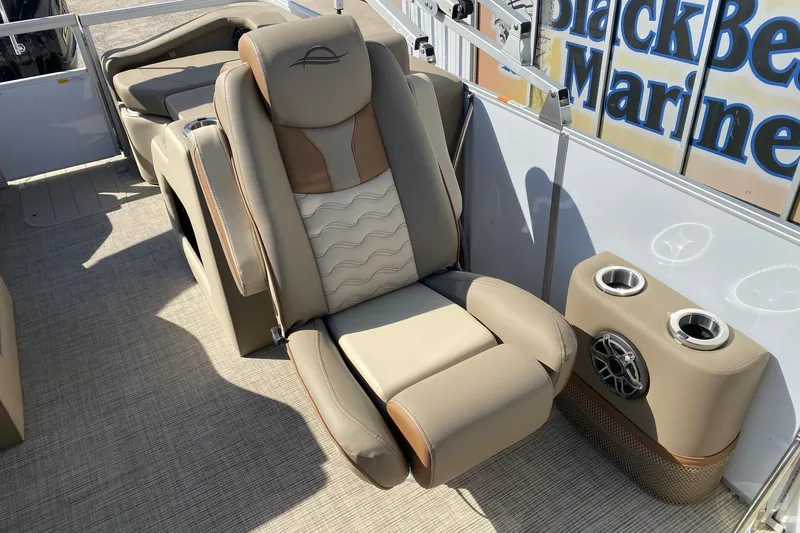 Slide: The Image of Luxurious seating on 2026 SunCatcher Elite 324 SS boat with cup holders and speaker. - 8