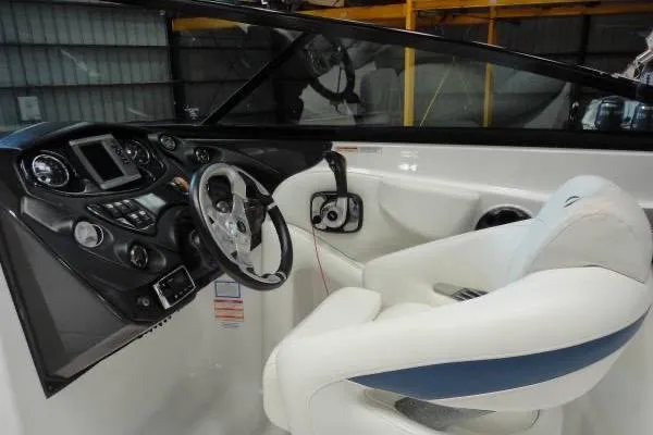 Slide: The Image of 2015 Monterey 264FS boat interior with steering wheel and control panel. - 10