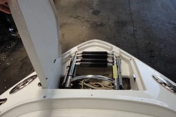 Slide: The Image of 2015 Monterey 264FS boat with open hatch and ladder storage. - 16