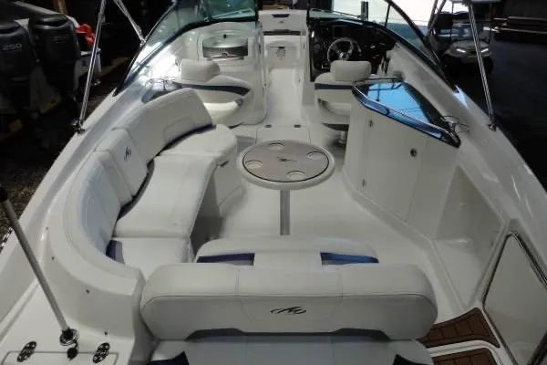 Slide: The Image of 2015 Monterey 264FS boat interior with spacious seating and sleek design. - 6