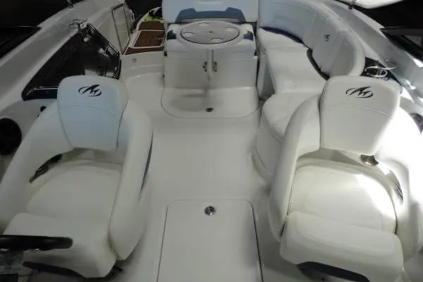 Slide: The Image of 2015 Monterey 264FS boat interior with white seating and sleek design. - 7