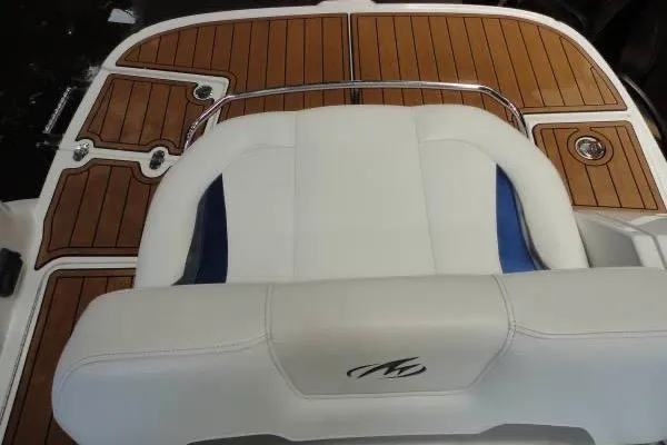 Slide: The Image of 2015 Monterey 264FS boat with teak deck and white seating. - 8