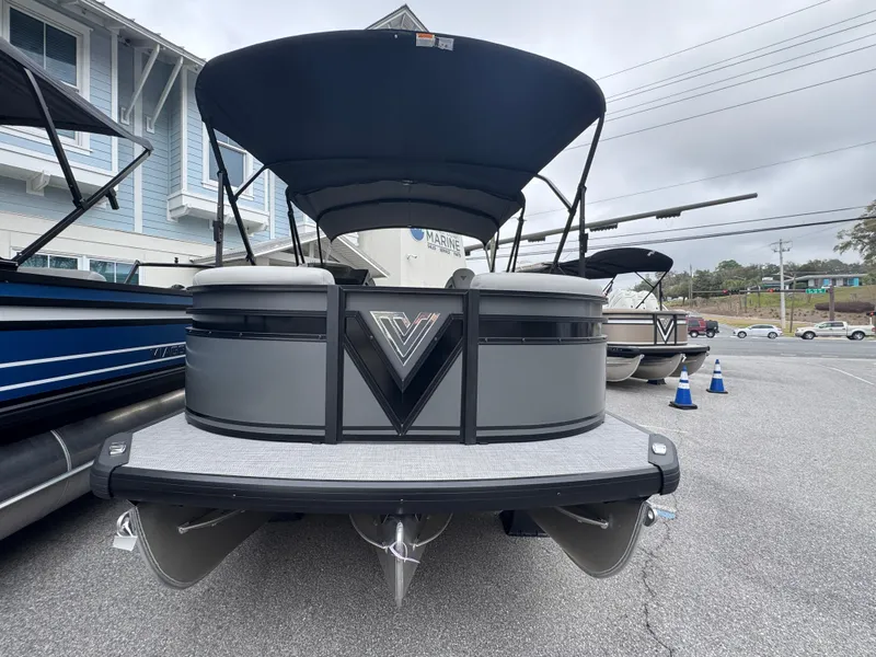 Slide: The Image of 2025 Viaggio Lago X-S pontoon boat with canopy, displayed outdoors. - 1