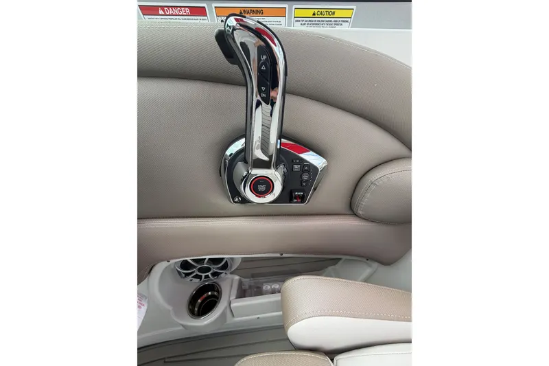 Slide: The Image of Control panel of 2026 Crownline 278 SS boat with start-stop button and throttle lever. - 10