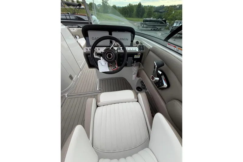 Slide: The Image of 2026 Crownline 278 SS boat interior with steering wheel and dashboard controls. - 12