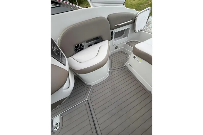 Slide: The Image of 2026 Crownline 278 SS boat interior with gray flooring and cushioned seating. - 18