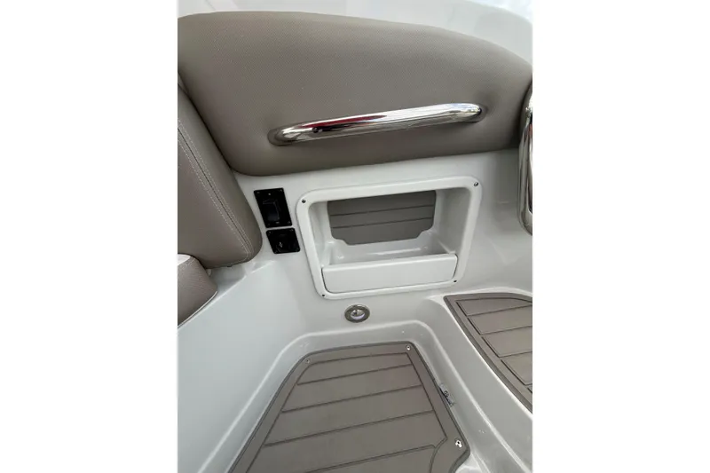 Slide: The Image of Interior detail of 2026 Crownline 278 SS boat, featuring storage compartment and sleek design. - 8