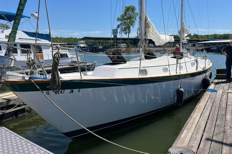The Image of 1979 Pearson 424 sailboat docked at marina, featuring white hull and rigging. - 0