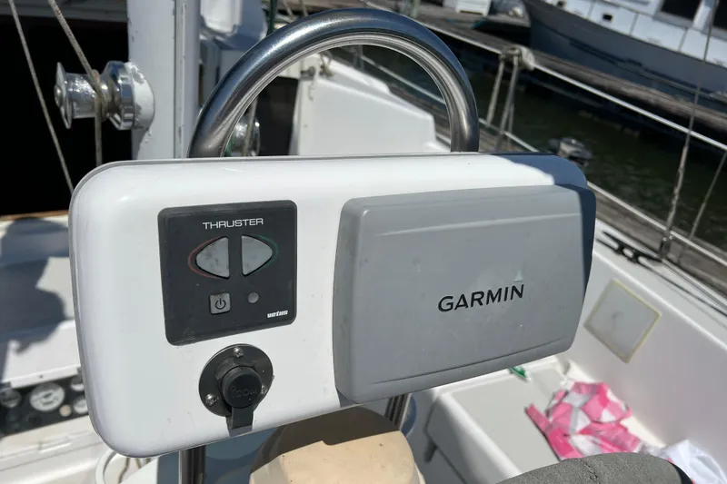 Slide: The Image of Garmin navigation system on 1979 Pearson 424 sailboat, featuring thruster controls. - 20
