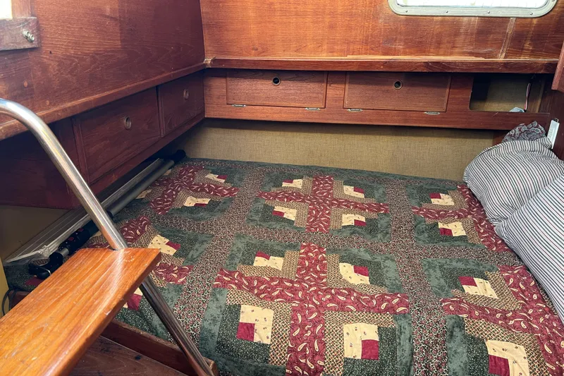 Slide: The Image of Cozy cabin interior of 1979 Pearson 424 sailboat with quilted bedding. - 37