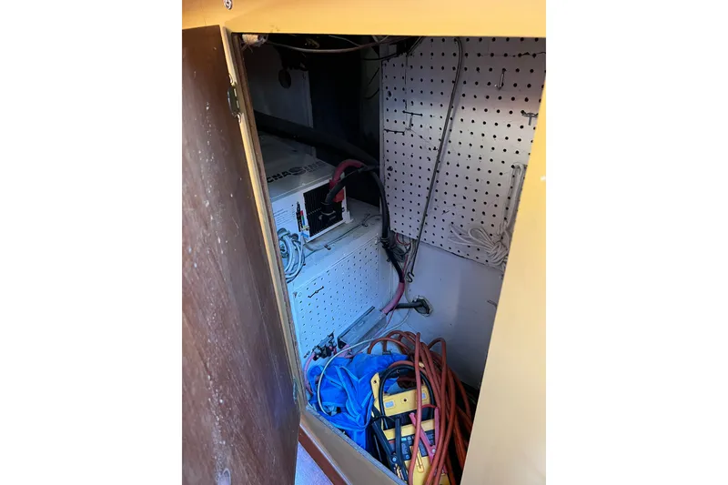 Slide: The Image of Electrical compartment of a 1979 Pearson 424 sailboat with cables and equipment. - 40