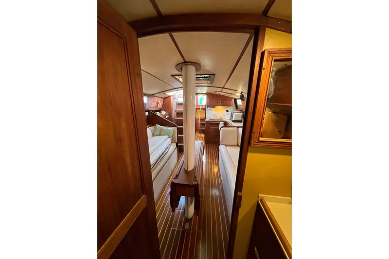 Slide: The Image of Interior of 1979 Pearson 424 sailboat with wooden finishes and cozy seating area. - 67