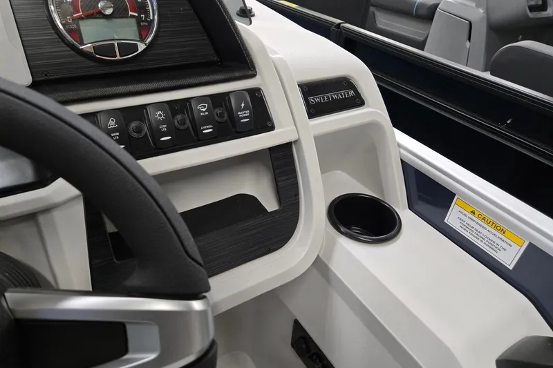 Slide: The Image of 2026 Godfrey Sweetwater 2086 C dashboard with controls and cup holder. - 14