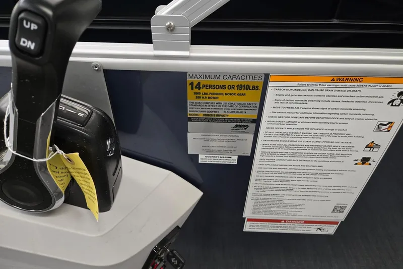 Slide: The Image of Control panel and capacity warning on 2026 Godfrey Sweetwater 2086 C boat. - 15