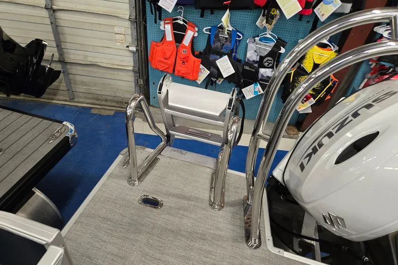 Slide: The Image of 2026 Godfrey Sweetwater 2086 C boat with Suzuki engine and safety gear display. - 19