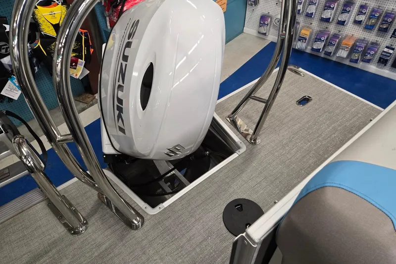 Slide: The Image of Godfrey Sweetwater 2086 C boat with Suzuki engine, showcasing deck and accessories. - 20
