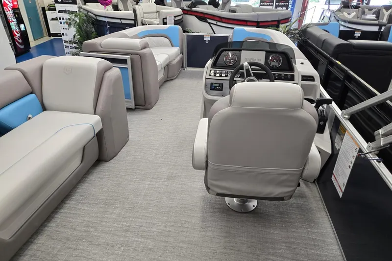 Slide: The Image of Interior view of 2026 Godfrey Sweetwater 2086 C pontoon boat with plush seating and modern helm. - 21