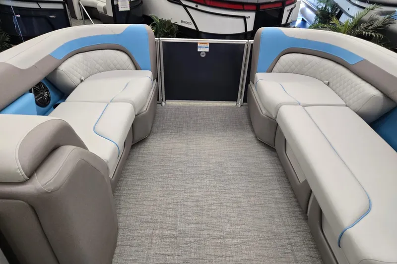 Slide: The Image of 2026 Godfrey Sweetwater 2086 C pontoon boat interior with plush seating and modern design. - 25